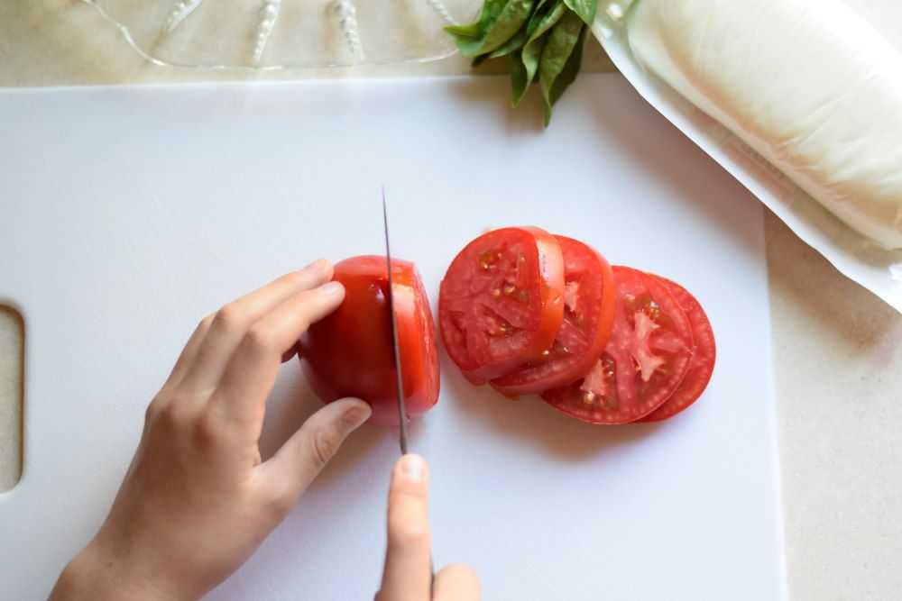 Slicing tomatoes.
