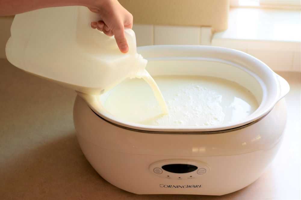 Pouring milk into a slow cooker