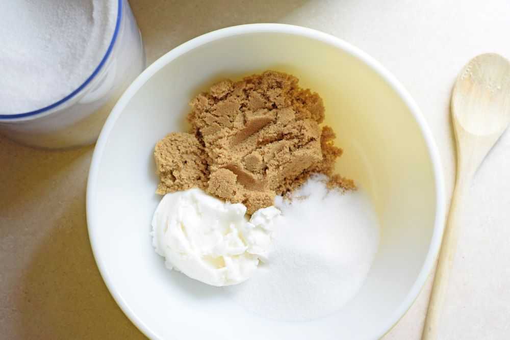 Cream the shortening and sugars together in a large bowl.