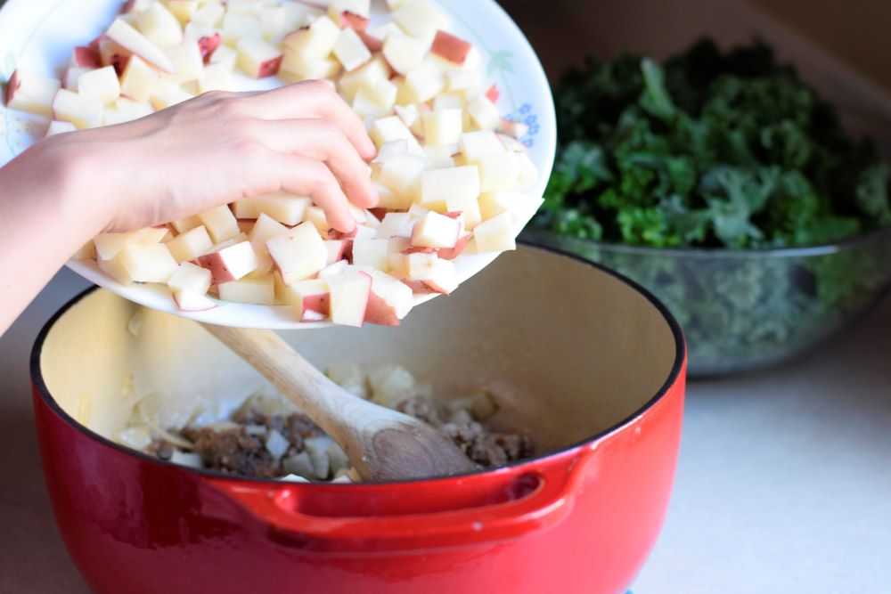 Add potatoes to the sausage potato and kale soup