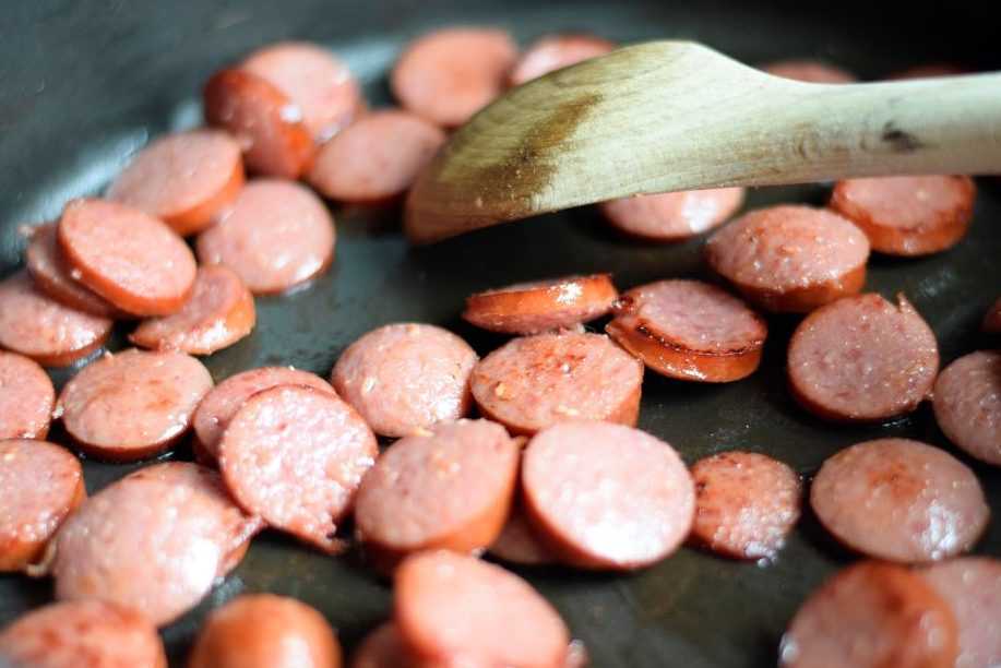 Cook the kielbasa until it starts to brown.